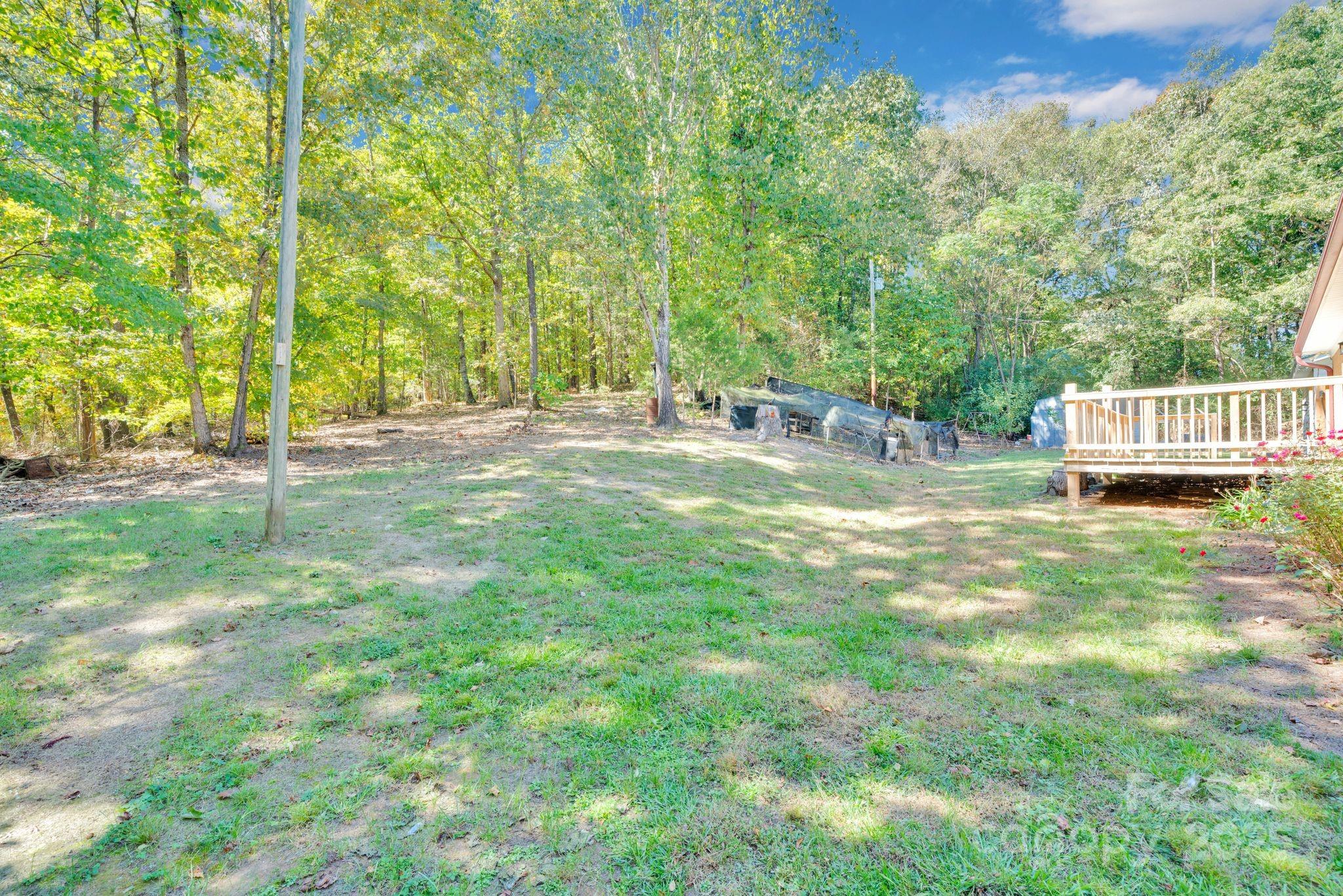 4612 Huggins Road Marshville, NC 28103 - Photo 25 of 37 a view of a yard with large trees