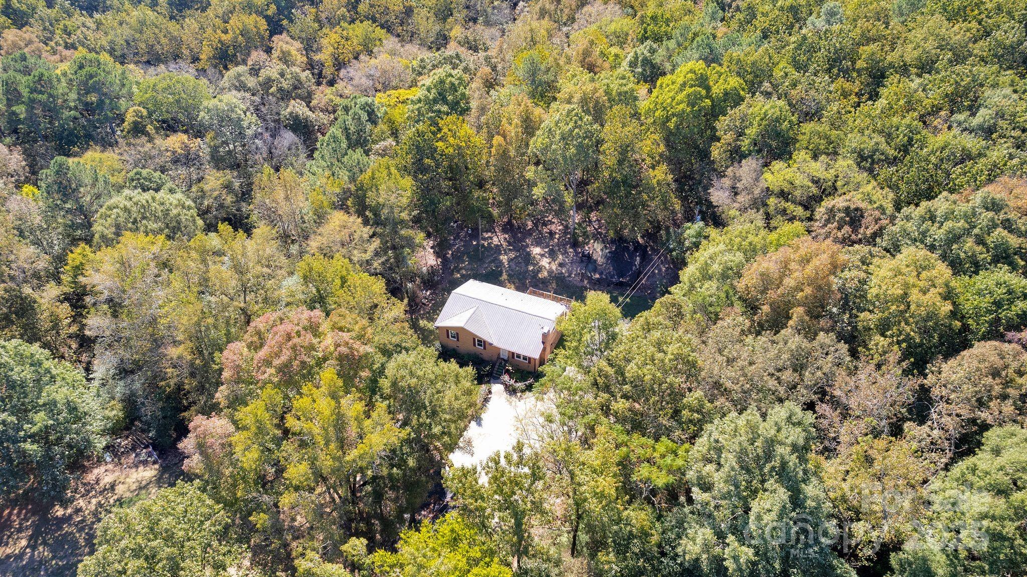 4612 Huggins Road Marshville, NC 28103 - Photo 34 of 37 a backyard of a house with a yard and fountain