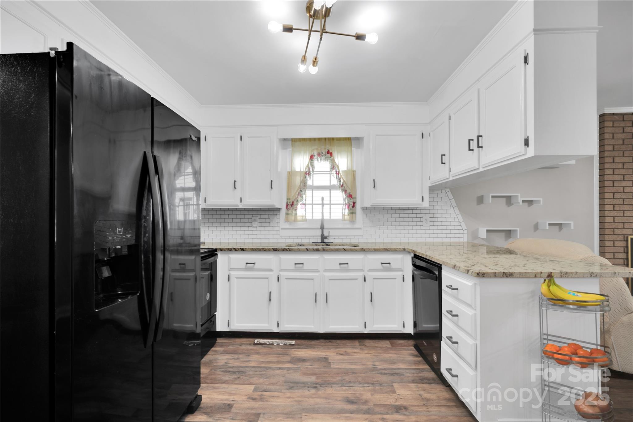 4612 Huggins Road Marshville, NC 28103 - Photo 5 of 37 a kitchen with stainless steel appliances granite countertop a sink stove and refrigerator