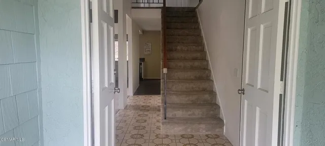 a view of a hallway with a glass door