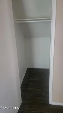 a view of a kitchen from the hallway