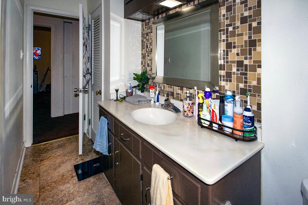 412 Swarthmore Road Glassboro, NJ 08028 - Photo 17 of 50 a bathroom with a sink vanity and a mirror