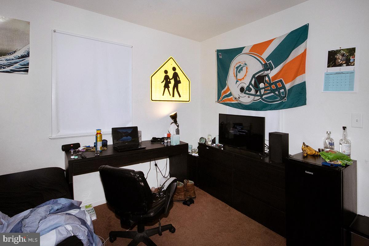 412 Swarthmore Road Glassboro, NJ 08028 - Photo 19 of 50 a work room with furniture and painting on the wall