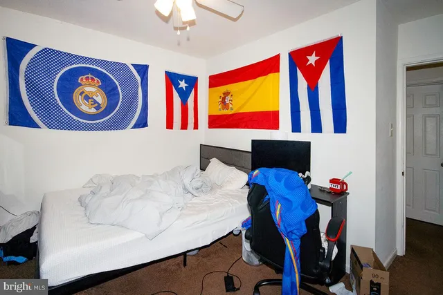 a bedroom with furniture and a window