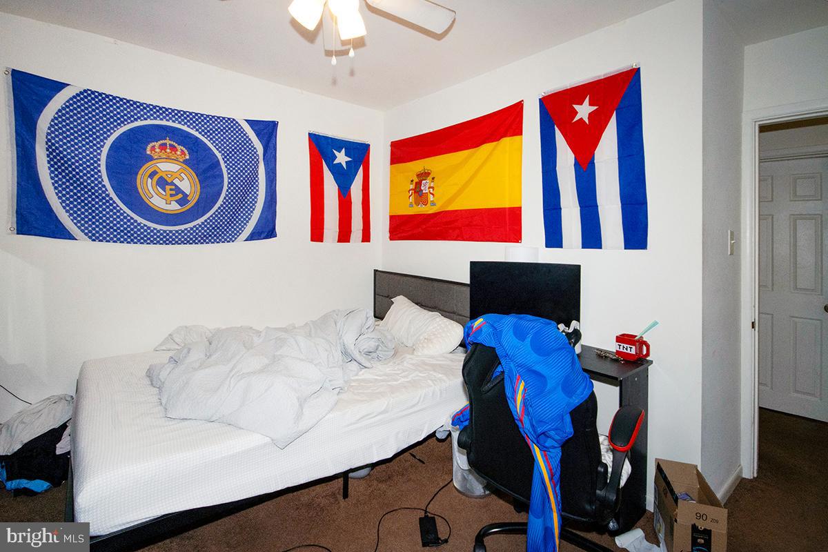 412 Swarthmore Road Glassboro, NJ 08028 - Photo 23 of 50 a living room with furniture and wall paintings
