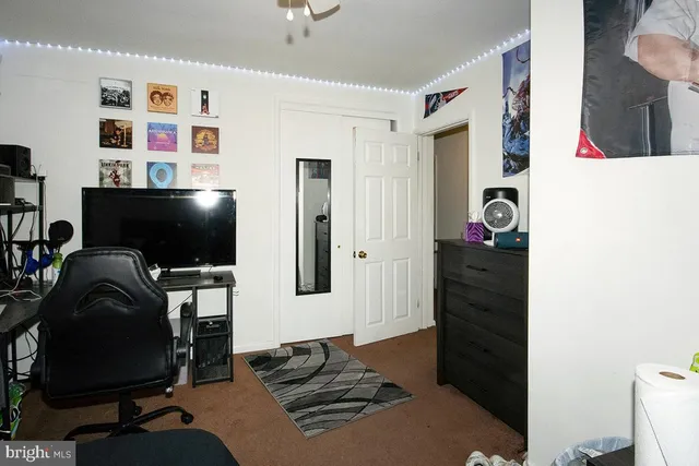 a view of a workspace with furniture and bedroom