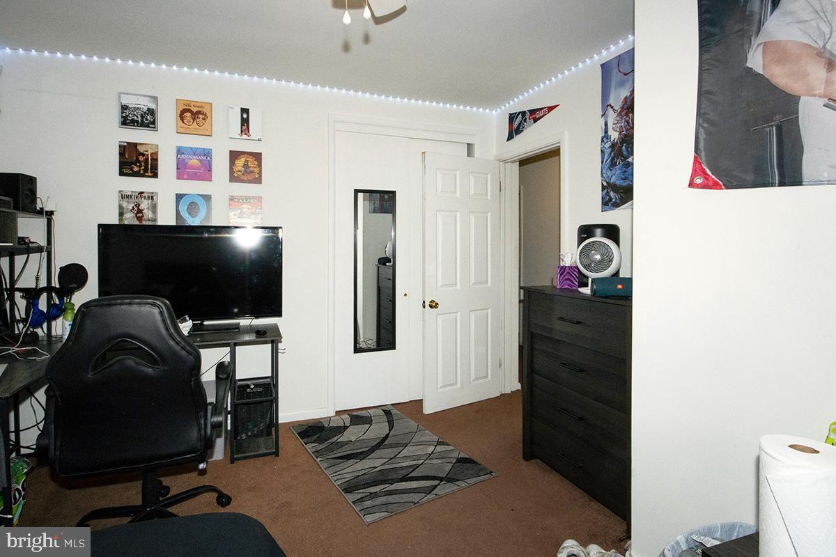 412 Swarthmore Road Glassboro, NJ 08028 - Photo 27 of 50 a living room with furniture and a flat screen tv