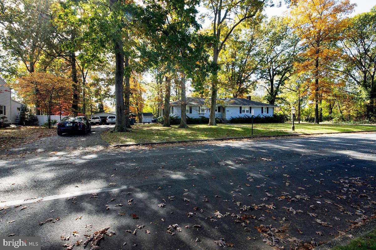 412 Swarthmore Road Glassboro, NJ 08028 - Photo 4 of 50 a view of a street with houses and trees