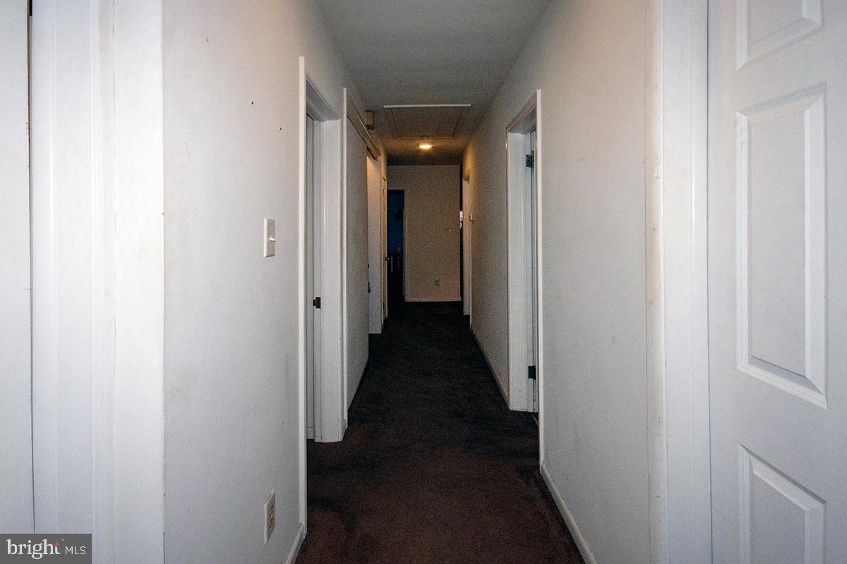 412 Swarthmore Road Glassboro, NJ 08028 - Photo 42 of 50 a view of a hallway with a wooden door