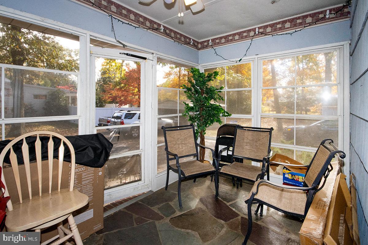 412 Swarthmore Road Glassboro, NJ 08028 - Photo 47 of 50 a view of a dining room with furniture wooden floor and a chandelier