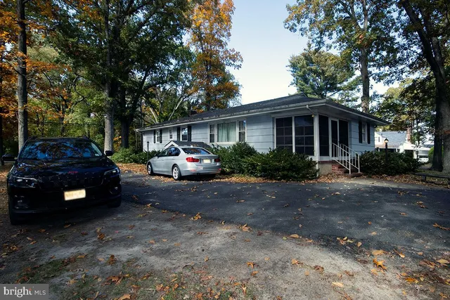 a view of a car parked in front of house