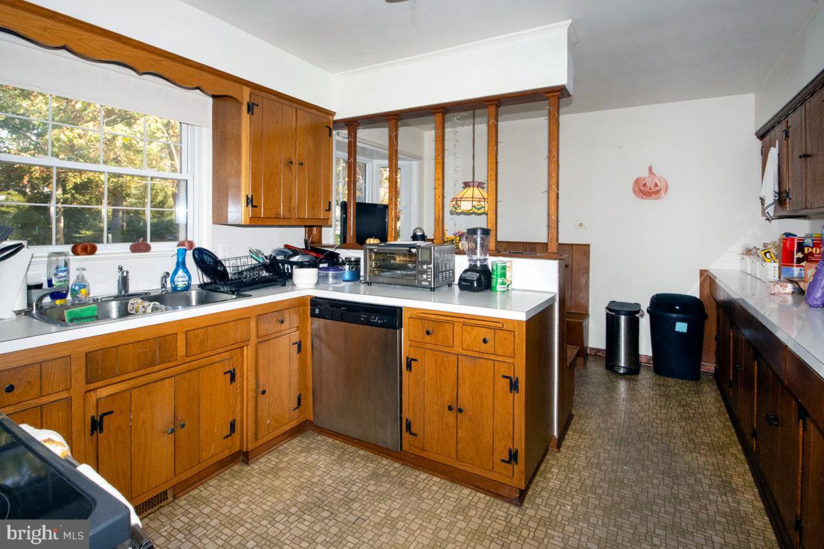 412 Swarthmore Road Glassboro, NJ 08028 - Photo 7 of 50 a kitchen with stainless steel appliances sink cabinets and window