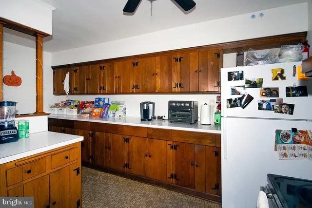a kitchen with stainless steel appliances granite countertop a refrigerator and sink