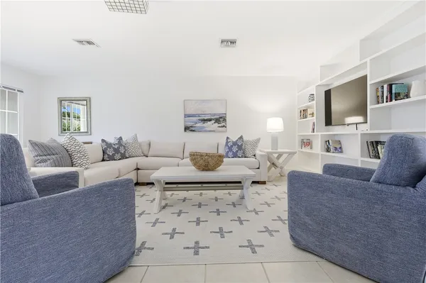 a living room with furniture and a couch