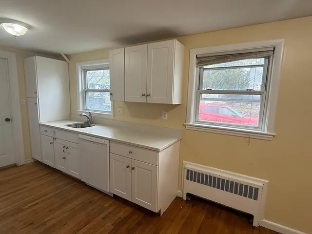 a room with cabinets and wooden floor