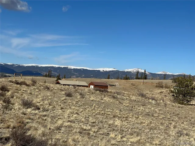 a view of mountains and sunset