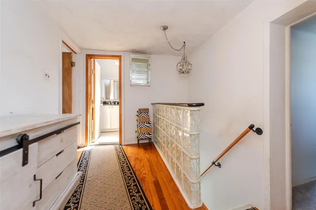 a view of a hallway with windows