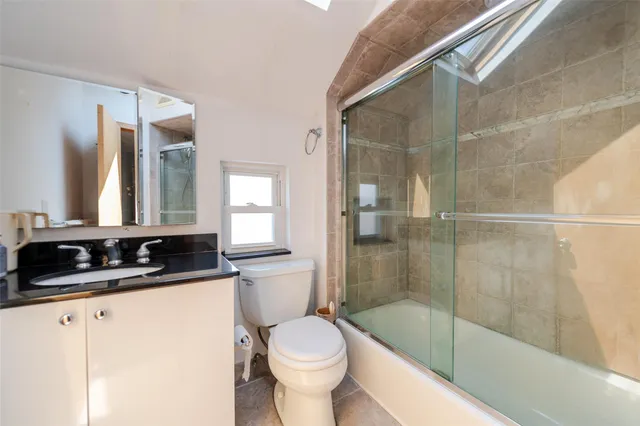 a bathroom with a bathtub and a sink