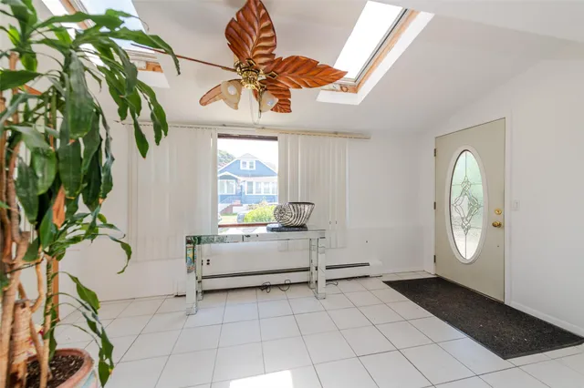 a view of a entryway with furniture and a potted plant