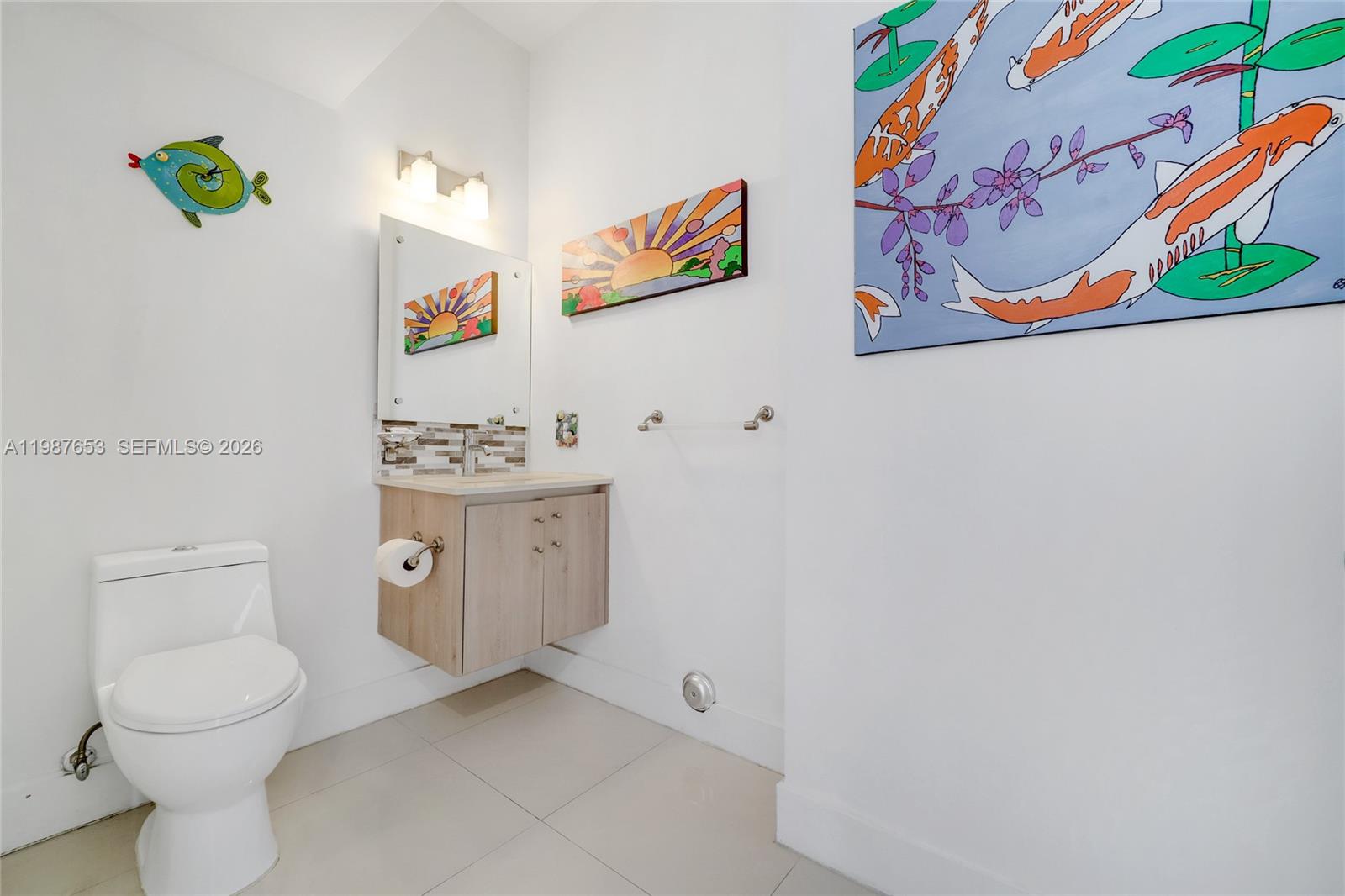 2943 Southwest 23rd Street Miami, FL 33145 - Photo 5 of 19 a bathroom with a toilet and a sink