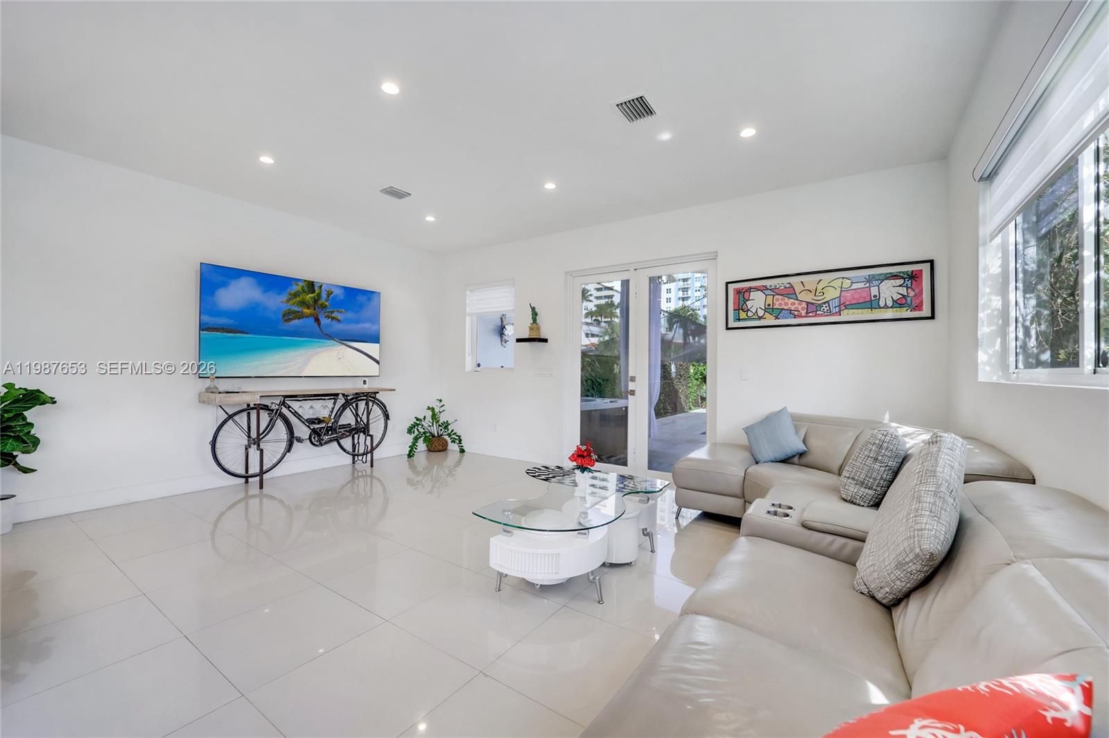 2943 Southwest 23rd Street Miami, FL 33145 - Photo 7 of 19 a living room with furniture and white walls