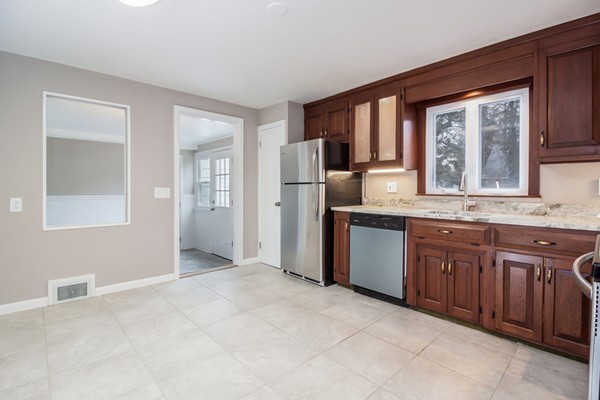 26 Kittrell Street Springfield, MA 01119 - Photo 8 of 21 a spacious bathroom with a granite countertop sink and a mirror