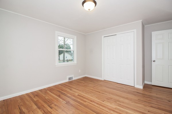 26 Kittrell Street Springfield, MA 01119 - Photo 10 of 21 an empty room with wooden floor and windows