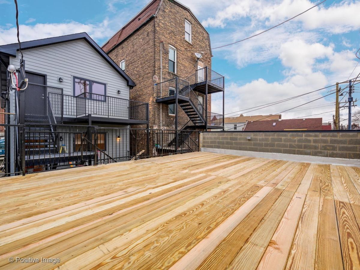 2307 West 19th Street, Unit 2 Chicago, IL 60608 - Photo 7 of 16 a view of a house with a on roof
