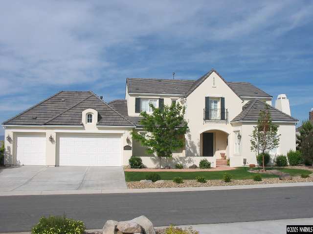 2950 Flint Ridge Court Reno, NV 89511 - Photo 1 of 7 a front view of a house with a yard and garage
