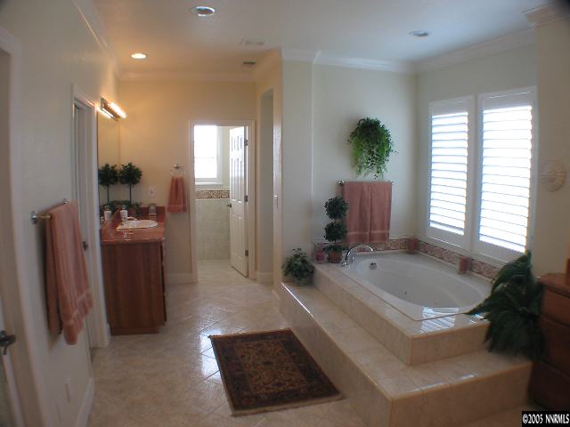 2950 Flint Ridge Court Reno, NV 89511 - Photo 5 of 7 a spacious bathroom with a tub shower and windows