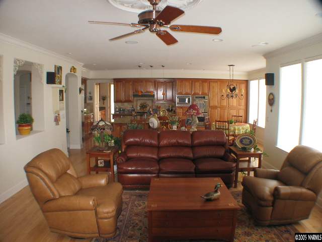 2950 Flint Ridge Court Reno, NV 89511 - Photo 6 of 7 a living room with furniture ceiling fan and a rug