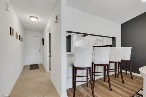 a view of kitchen with furniture and wooden floor