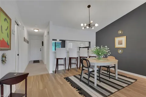 a view of a livingroom with furniture and chandelier