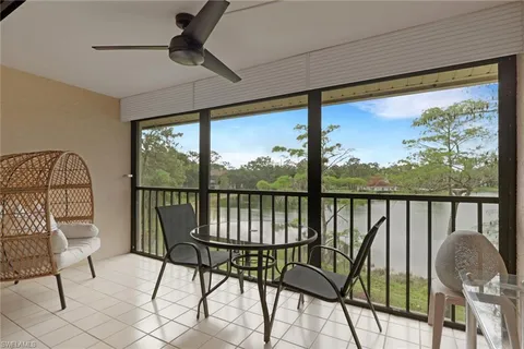 a view of a two chairs in the balcony