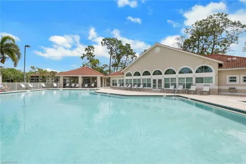 a view of a house with pool and a lake view