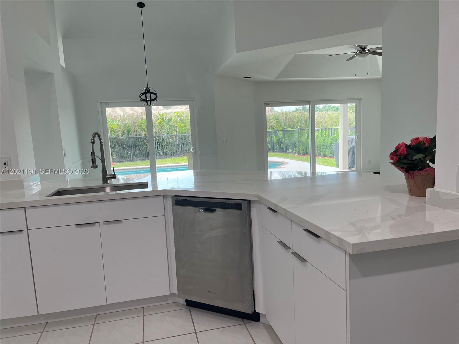 814 Heron Road Weston, FL 33326 - Photo 15 of 27 a kitchen with a sink and a window