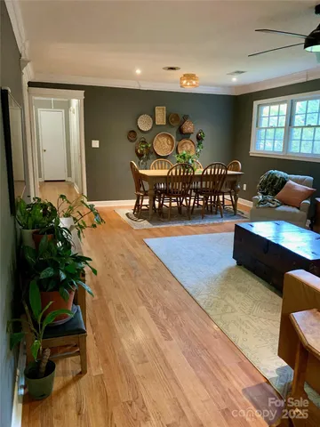 a bedroom with furniture and a potted plant