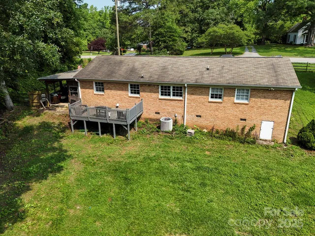 an aerial view of a house with a garden