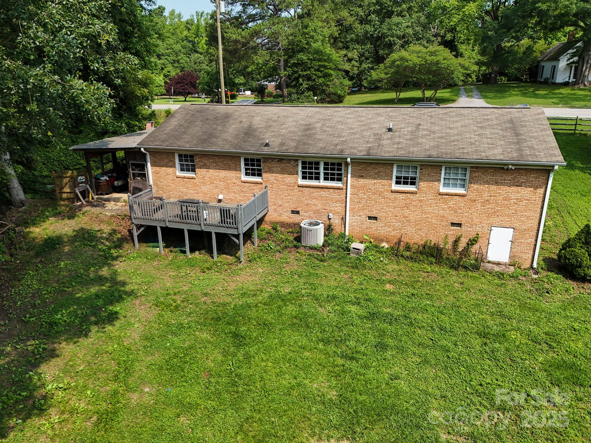 10672 Barberville Road Indian Land, SC 29707 - Photo 6 of 34 an aerial view of a house with a garden