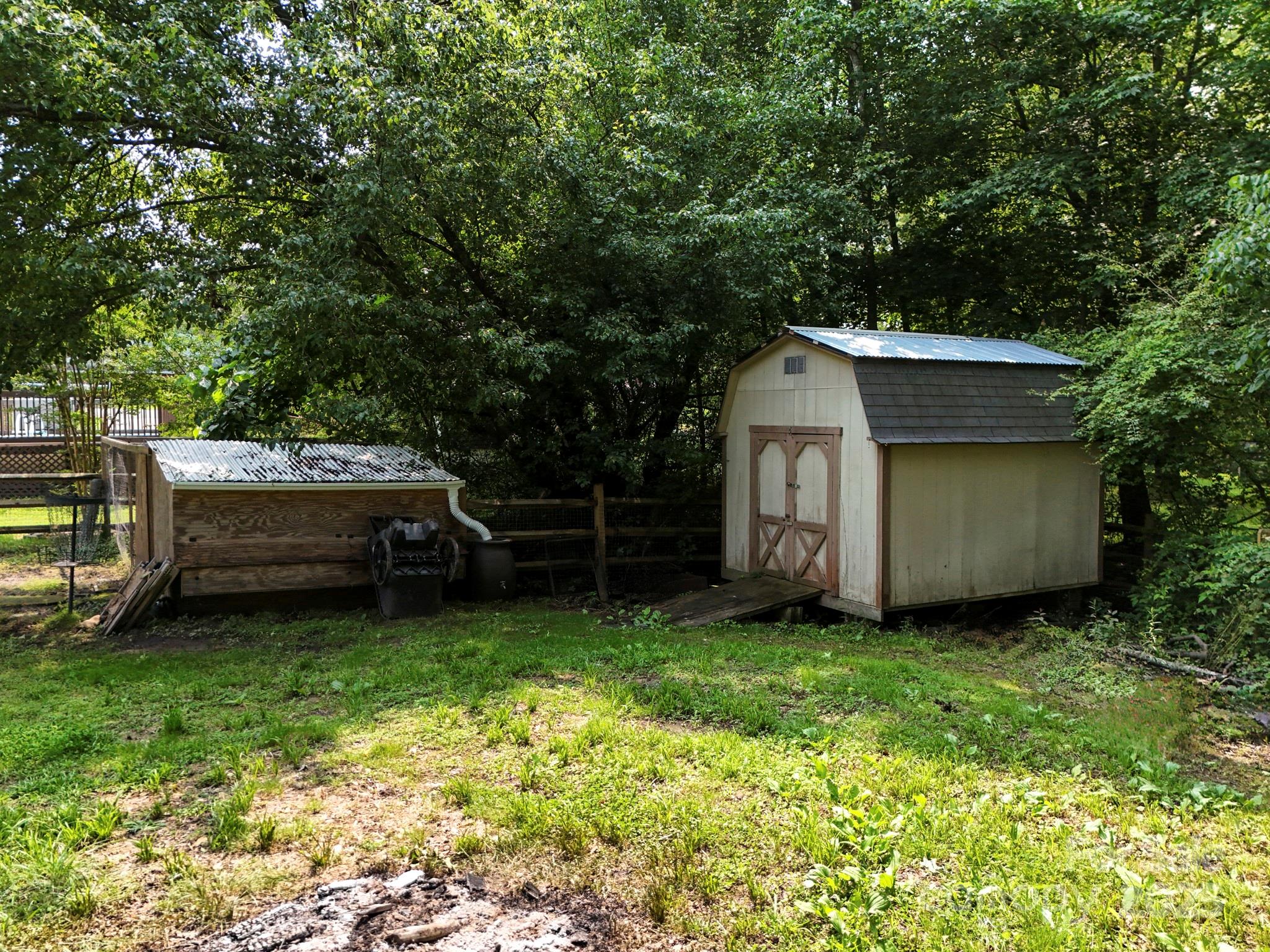 10672 Barberville Road Indian Land, SC 29707 - Photo 7 of 34 a view of a backyard with a small cabin