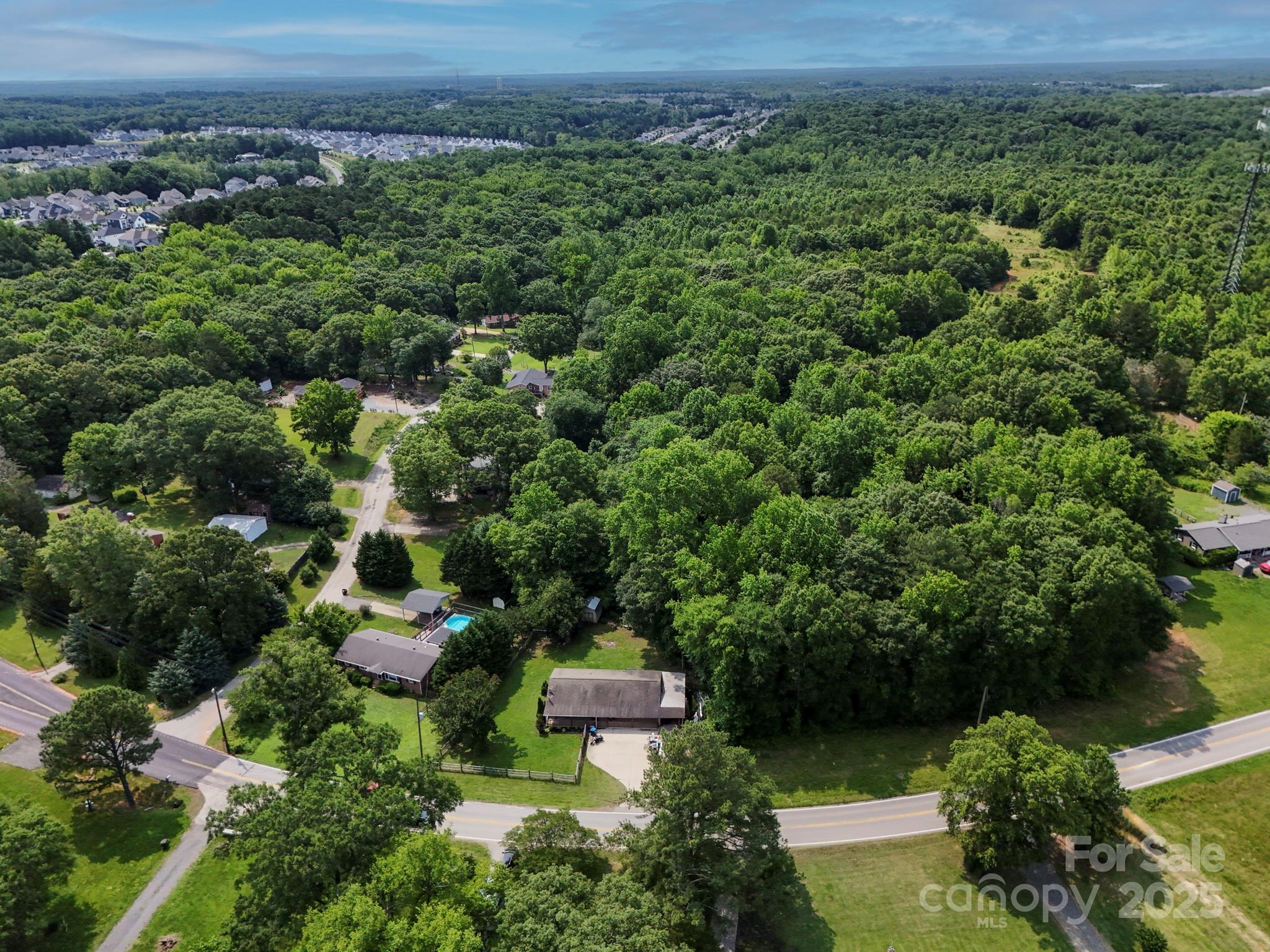 10672 Barberville Road Indian Land, SC 29707 - Photo 8 of 34 an aerial view of a house with a yard
