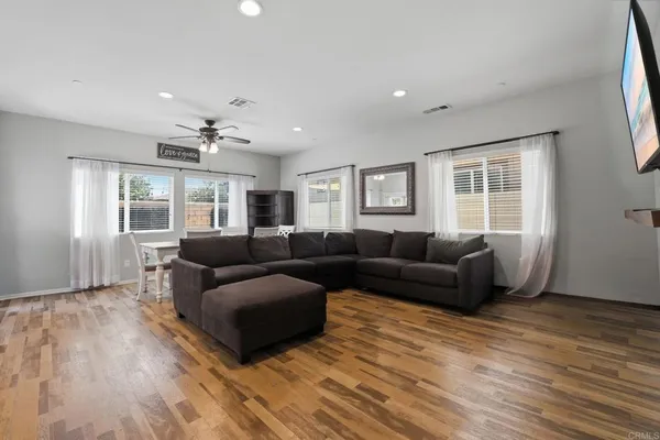 a living room with furniture and a window
