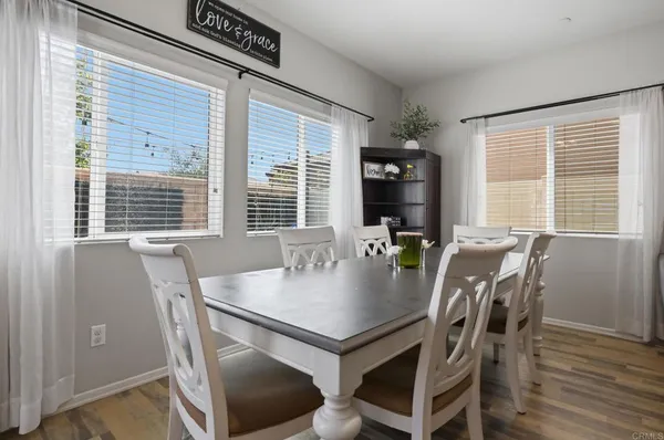 a view of a dining room with furniture and window