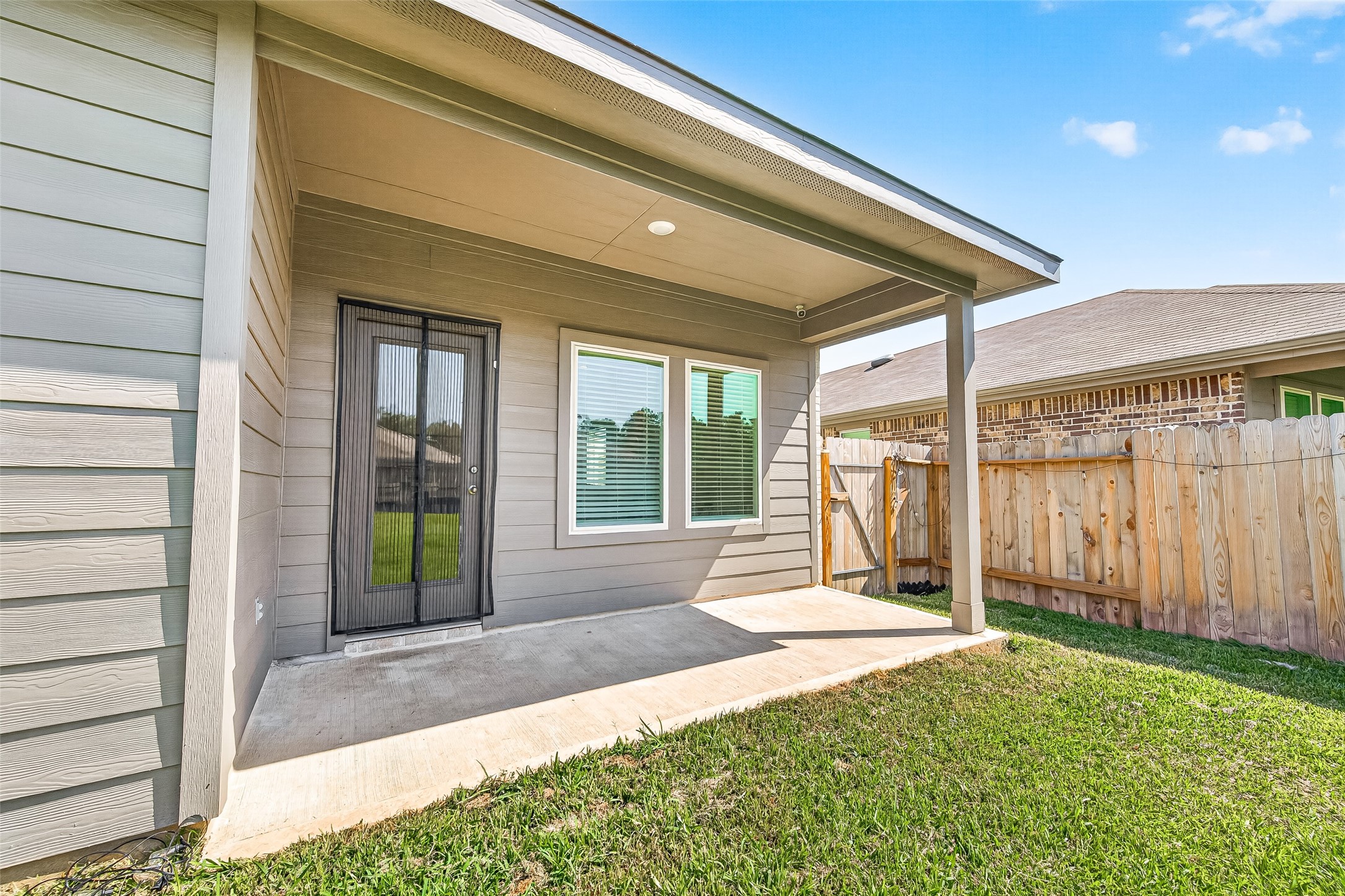 5442 Pinetree Cres Lane Spring, TX 77373 - Photo 19 of 24 The covered patio offers a comfortable outdoor living space perfect for relaxing and entertaining year-round
