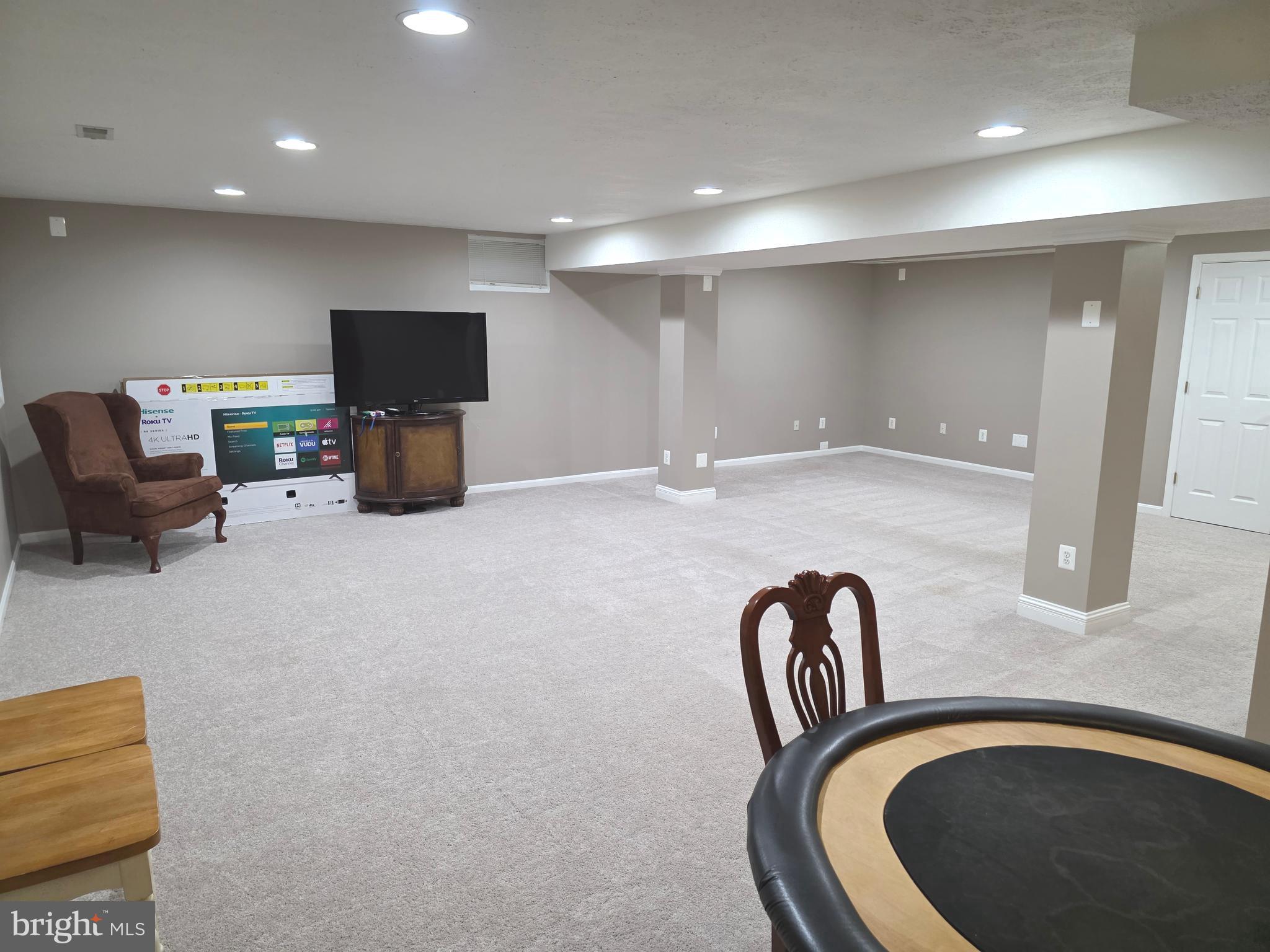 2441 Kemper Road Crofton, MD 21114 - Photo 58 of 63 a view of a livingroom with furniture and a flat screen tv