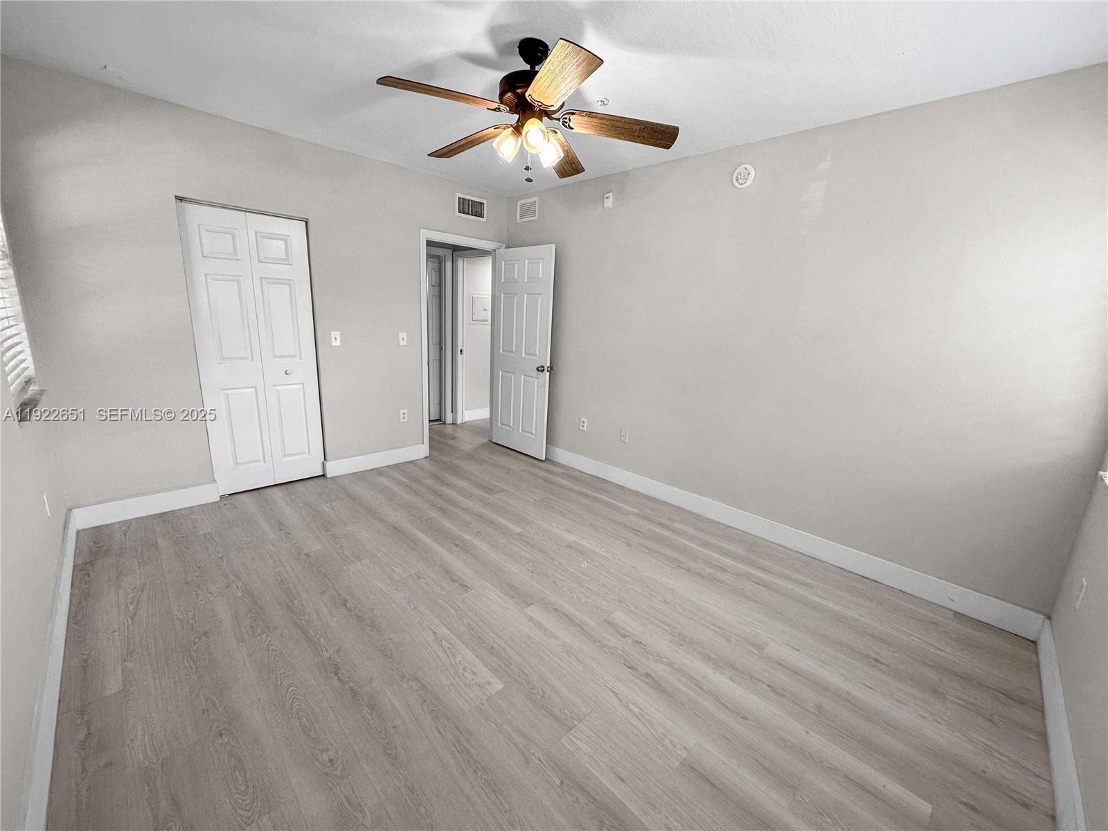 2120 West Preserve Way, Unit 301 Miramar, FL 33025 - Photo 12 of 28 a view of room with hardwood floor and ceiling fan