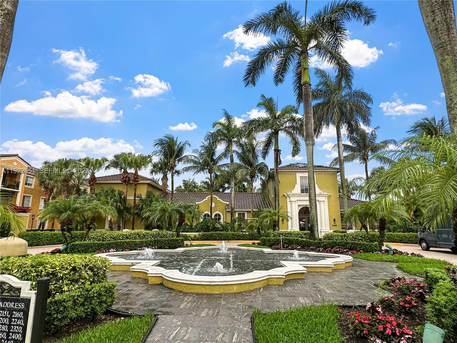 2120 West Preserve Way, Unit 301 Miramar, FL 33025 - Photo 2 of 28 a view of a fountain is middle in the garden