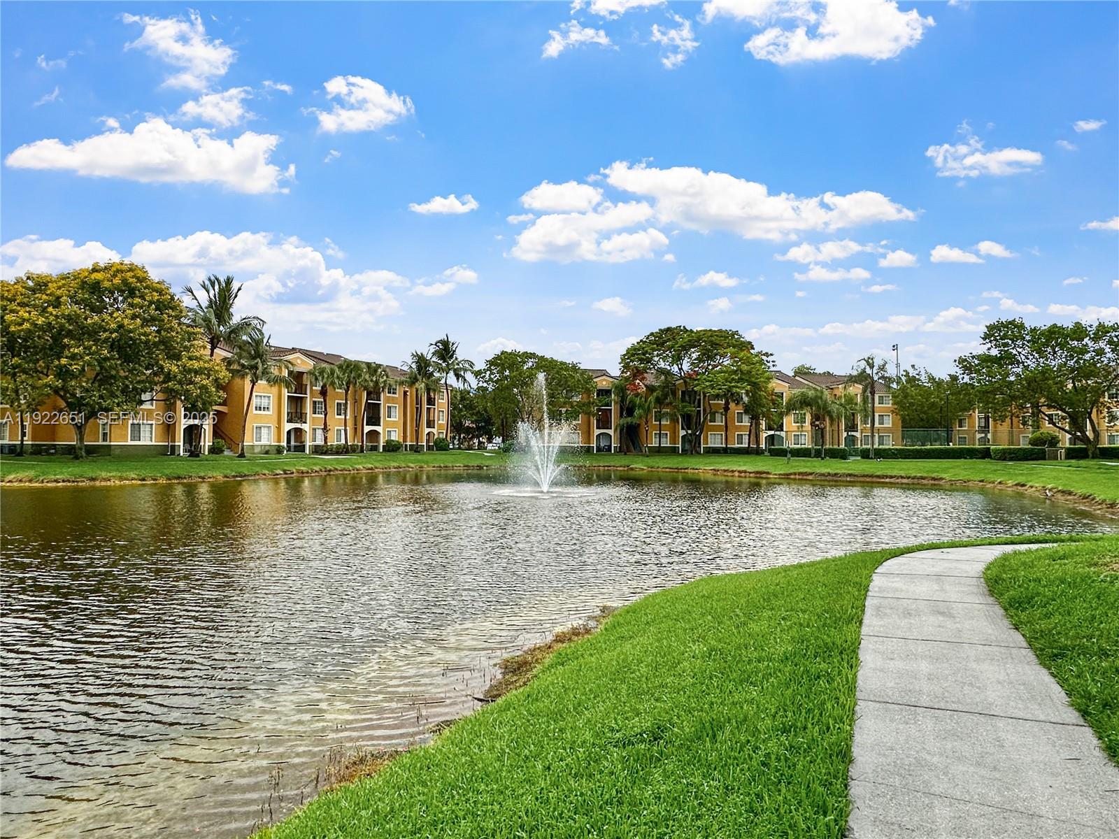 2120 West Preserve Way, Unit 301 Miramar, FL 33025 - Photo 24 of 28 a view of a lake with a building in the background