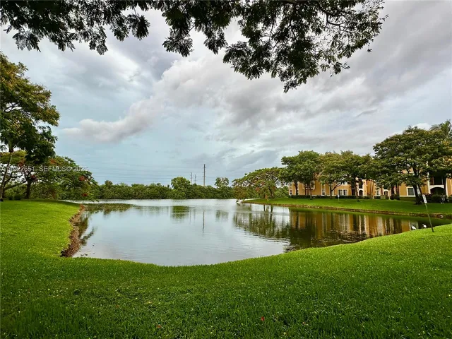 a sign that is sitting in front of flowers