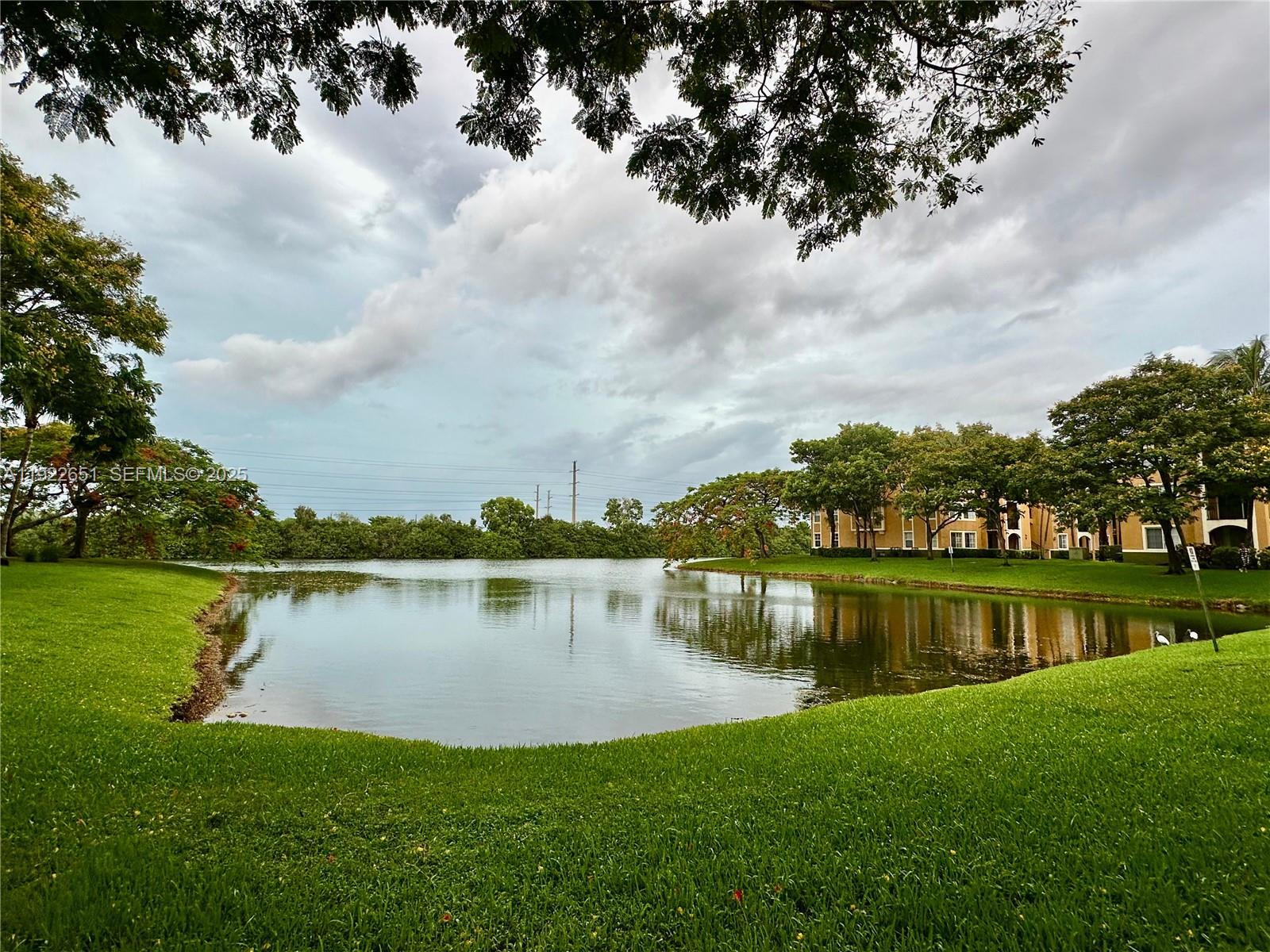 2120 West Preserve Way, Unit 301 Miramar, FL 33025 - Photo 26 of 28 a view of a lake with a lake in the background
